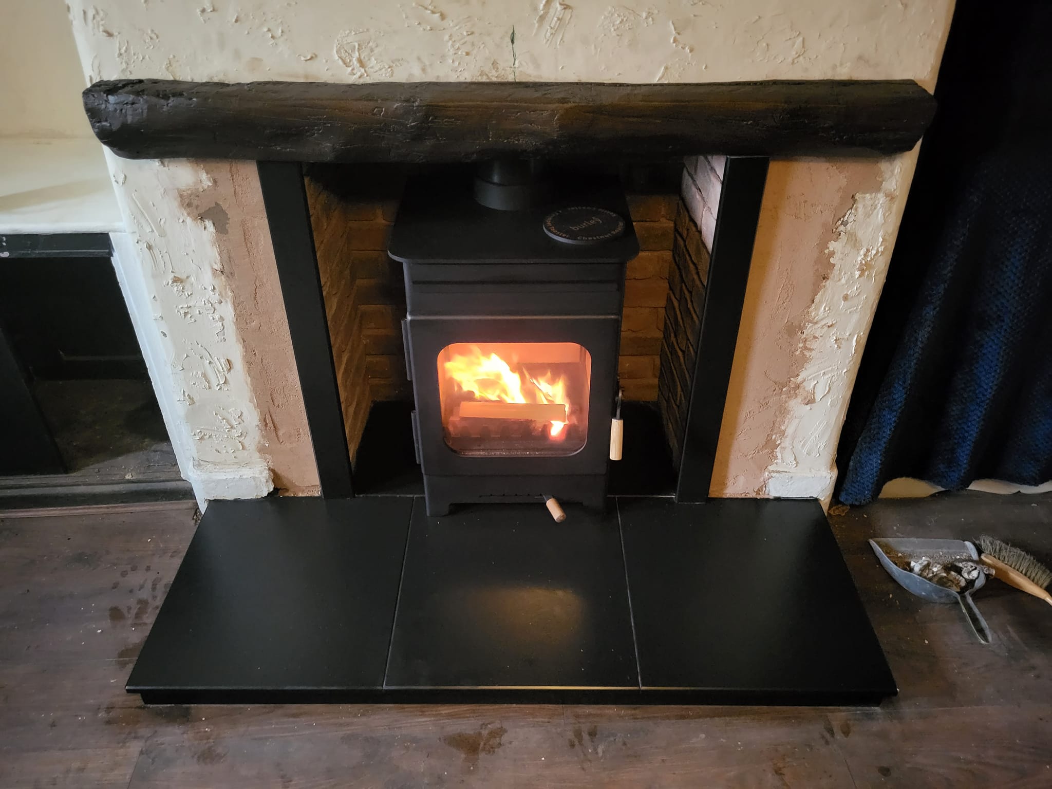 modern_fire_flue_installation_preston_traditional_cottage_wooden_lintel_black_tiles_hearth